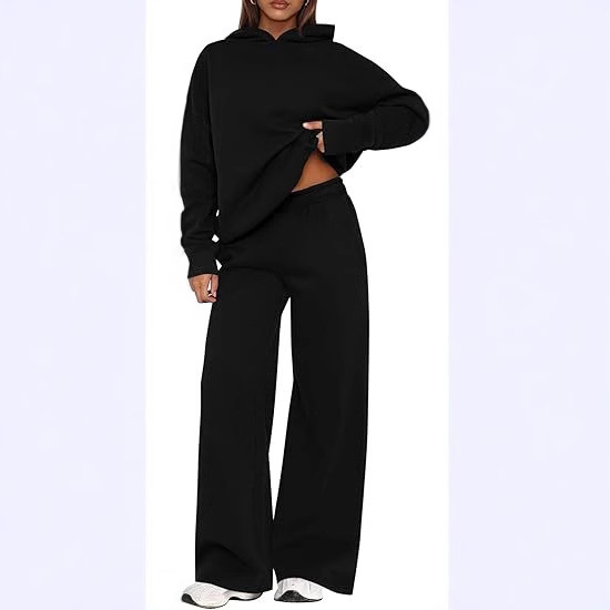 Two-piece women's sport set, including a solid color, long-sleeved, hooded sweatshirt with fleece lining and loose, wide-leg sports pants, suitable for autumn and winter