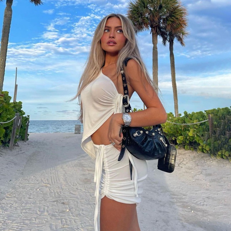 European and American style niche fashion summer set for women, featuring a one-shoulder design tank top and a ruffled short skirt, two-piece set