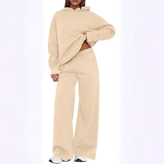 Two-piece women's sport set, including a solid color, long-sleeved, hooded sweatshirt with fleece lining and loose, wide-leg sports pants, suitable for autumn and winter